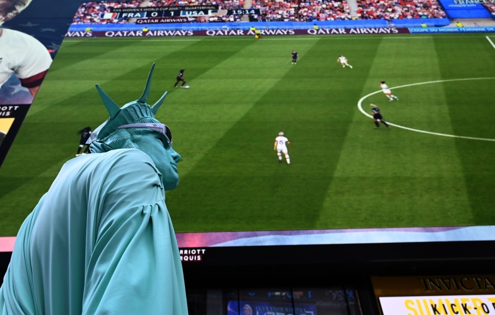 Fans watch the US team against France, during their Women's World Cup quarterfinal match, in Times Square in New York, US,  on Friday. — Reuters