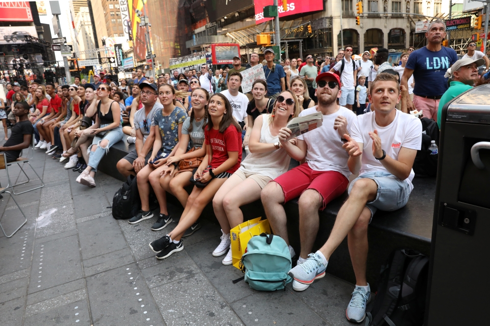 Fans watch the US team against France, during their Women's World Cup quarterfinal match, in Times Square in New York, US,  on Friday. — Reuters