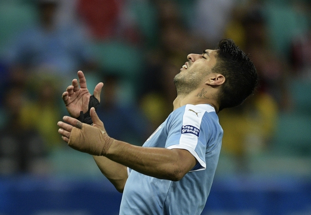 Uruguay's Luis Suarez reacts during the Copa America quarterfinal football match against Peru at the Fonte Nova Arena in Salvador, Brazil, on Saturday.  Peru beat Uruguay 5-4 via a penalty shootout to qualifying for the semifinal against Chile to be held in Porto Alegre on July 3. — AFP