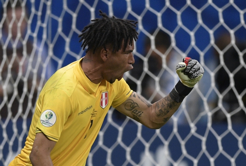 Uruguay's Luis Suarez reacts during the Copa America quarterfinal football match against Peru at the Fonte Nova Arena in Salvador, Brazil, on Saturday.  Peru beat Uruguay 5-4 via a penalty shootout to qualifying for the semifinal against Chile to be held in Porto Alegre on July 3. — AFP