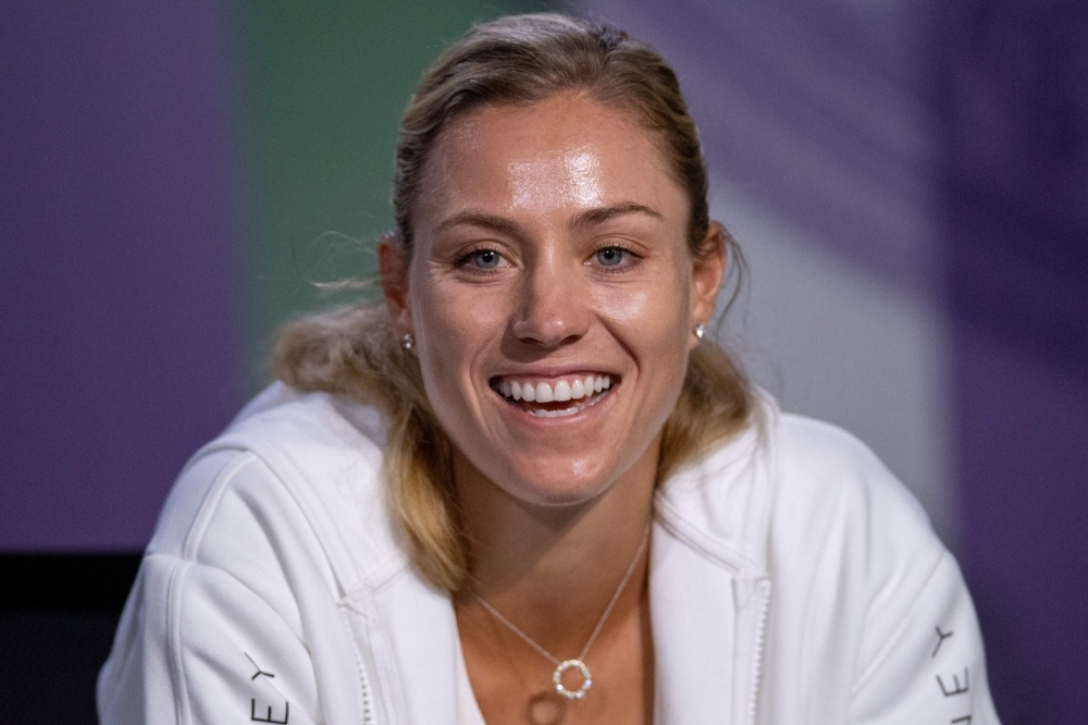 Defending women's singles champion, Germany's Angelique Kerber, speaks during a press conference at The All England Tennis Club in Wimbledon, southwest London, on Sunday, on the eve of the start of the 2019 Wimbledon Championships tennis tournament. — AFP