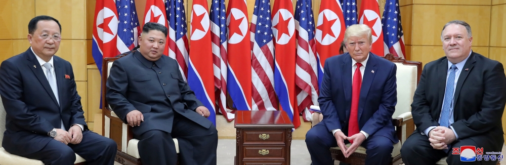 US President Donald Trump and Secretary of State Mike Pompeo pose for a photo with North Korean leader Kim Jong Un and North Korean foreign minister Ri Yong-ho during a meeting at the demilitarized zone (DMZ) separating the two Koreas, in Panmunjom, South Korea, on Sunday. -KCNA via REUTERS    