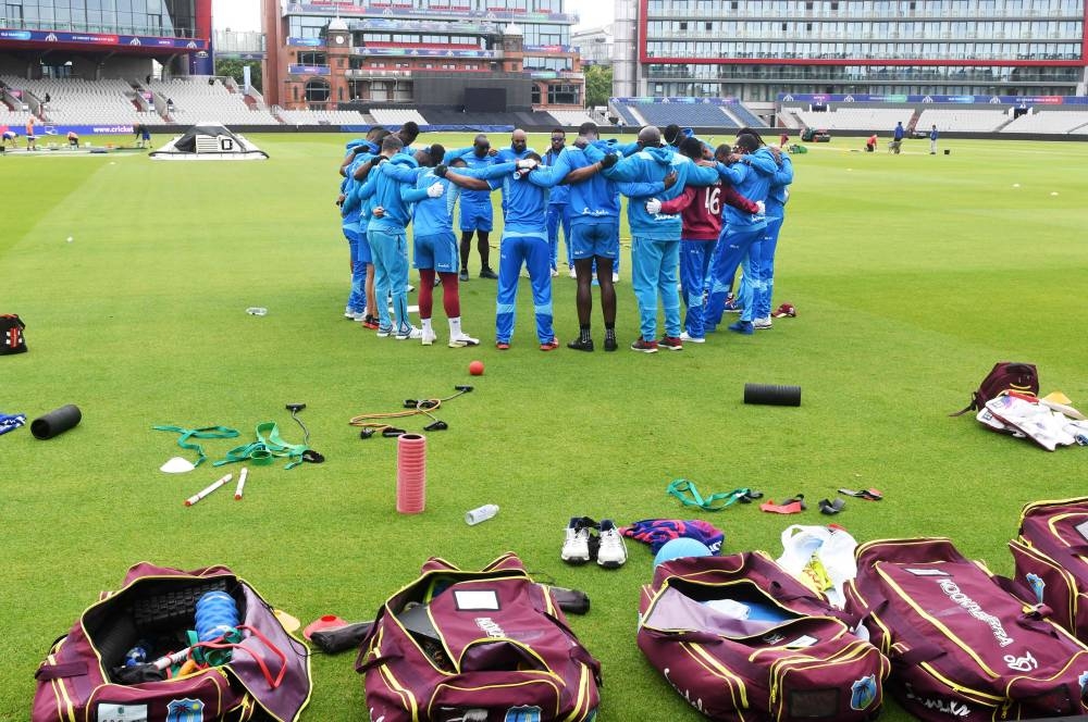 West Indies' players huddle during a training session at Old Trafford in Manchester, northwest England on Wednesday, ahead of their 2019 Cricket World Cup group stage match against India. — AFP