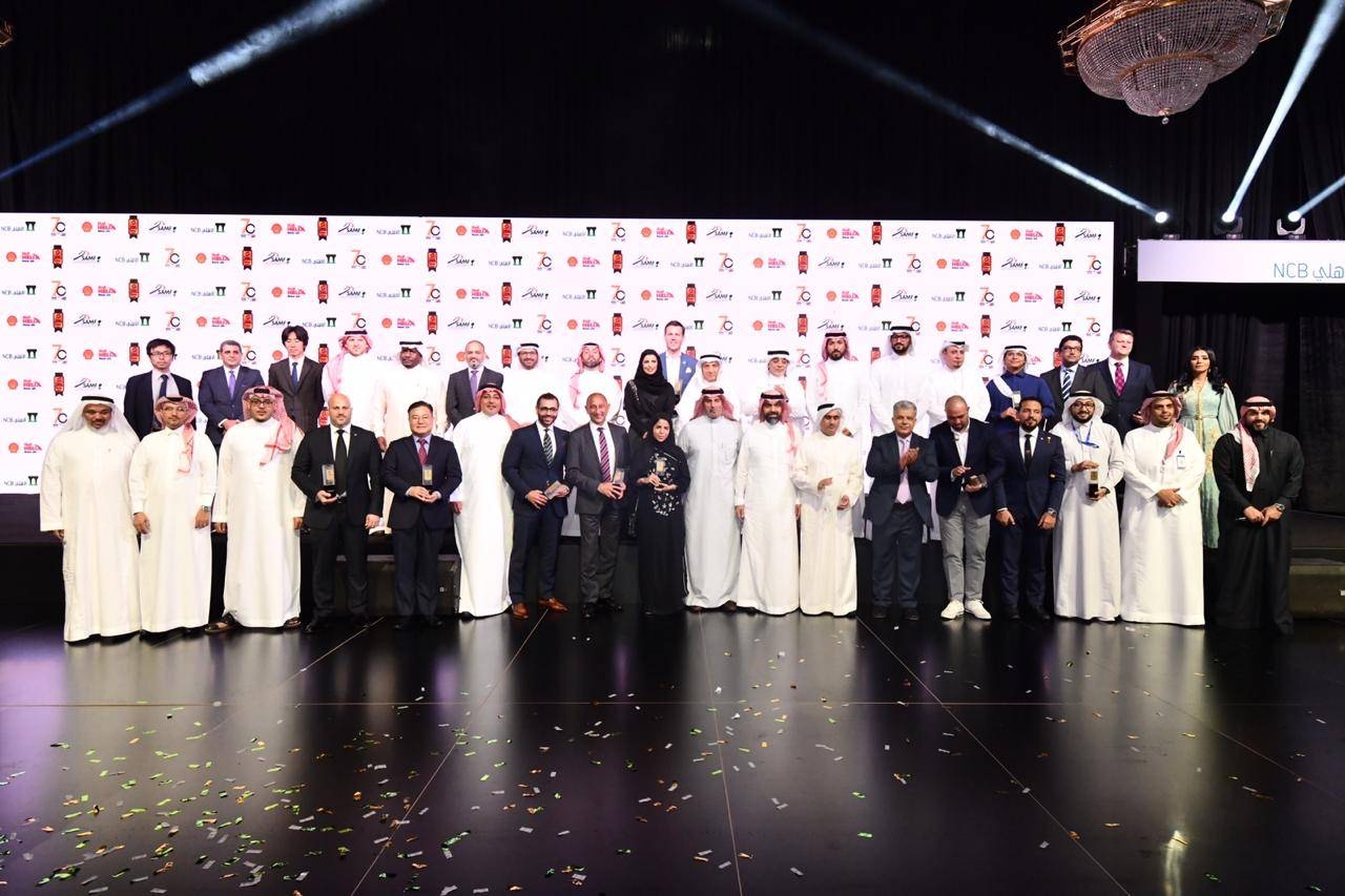 The winners pose with the dignitaries and officials of the event  