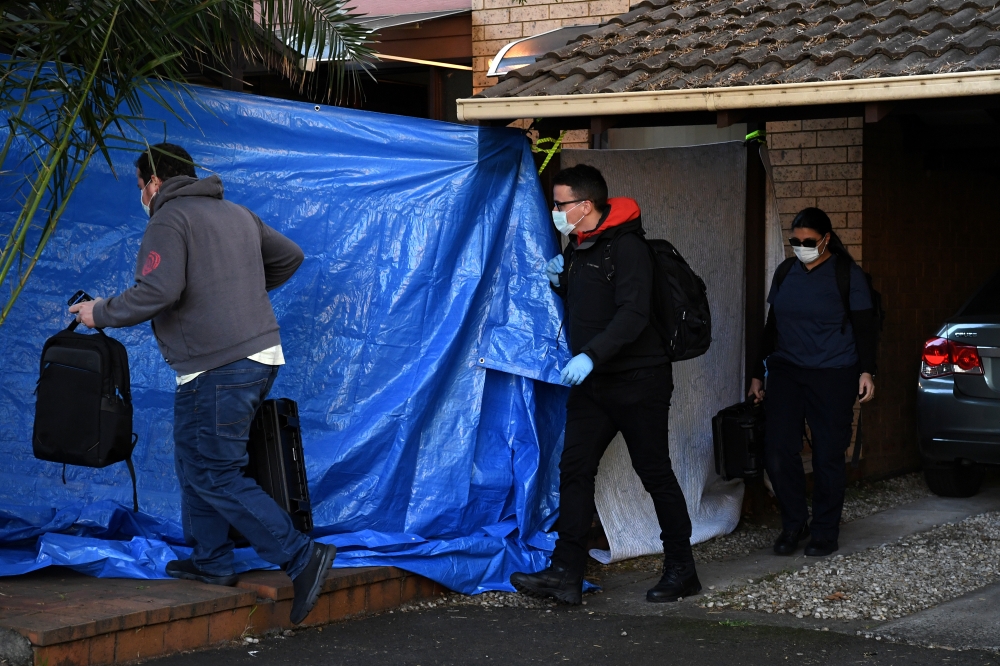 New South Wales Police raid a home in Greenacre, Sydney, on Tuesday. -AFP