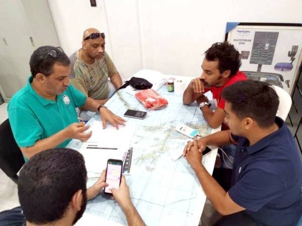 Search team gathering clues of the missing Saudi trainee pilot. — Okaz photo