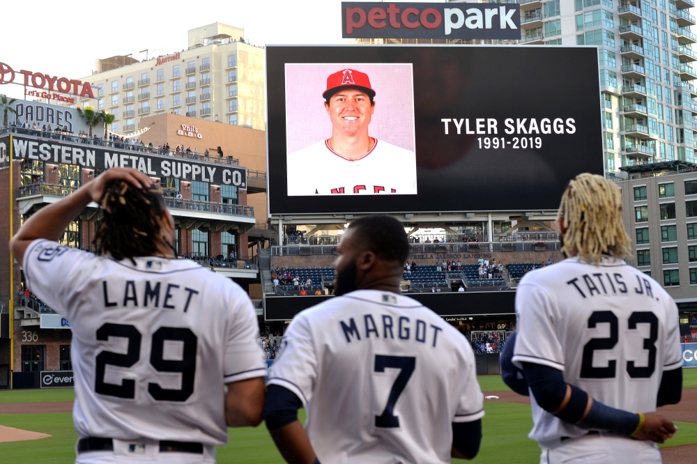 The San Diego Padres pay tribute to Los Angeles Angels pitcher Tyler Skaggs before a game against the San Francisco Giants at Petco Park, on Monday. — Reuters