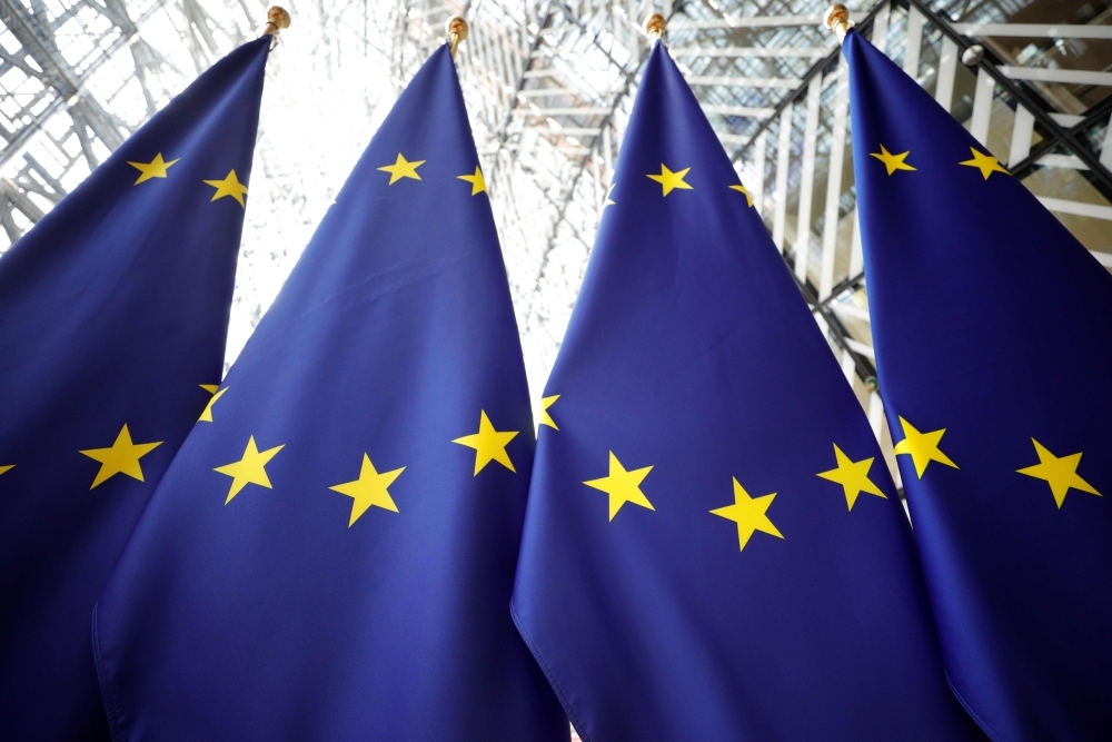 European flags are pictured as European Union leaders arrive for the third straight day of a summit in Brussels on Tuesday, for talks aimed at defusing fresh power struggles in a bid to fill the bloc's top jobs. — AFP