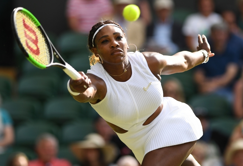 US player Serena Williams returns the ball to Italia's Giulia Gatto-Monticone during their women's singles first round match on the second day of the 2019 Wimbledon Championships at The All England Lawn Tennis Club in Wimbledon, southwest London, on Tuesday. — AFP