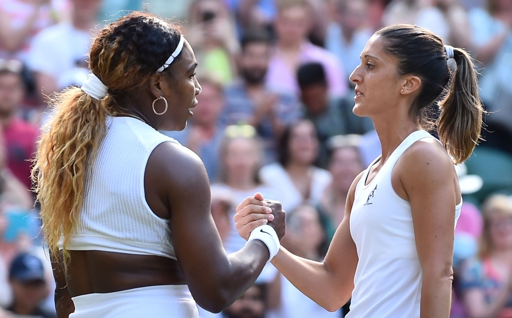 US player Serena Williams is congratulated by Italia's Giulia Gatto-Monticone after beating her during their women's singles first round match on the second day of the 2019 Wimbledon Championships at The All England Lawn Tennis Club in Wimbledon, southwest London, on Tuesday. — AFP