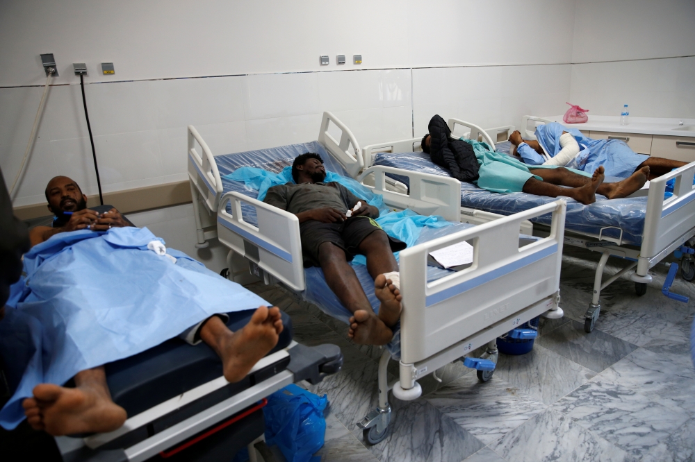 Wounded migrants lie on hospital beds after an airstrike hit a detention center for mainly African migrants in Tajoura, in Tripoli Central Hospital, Libya on Wednesday. — Reuters photos