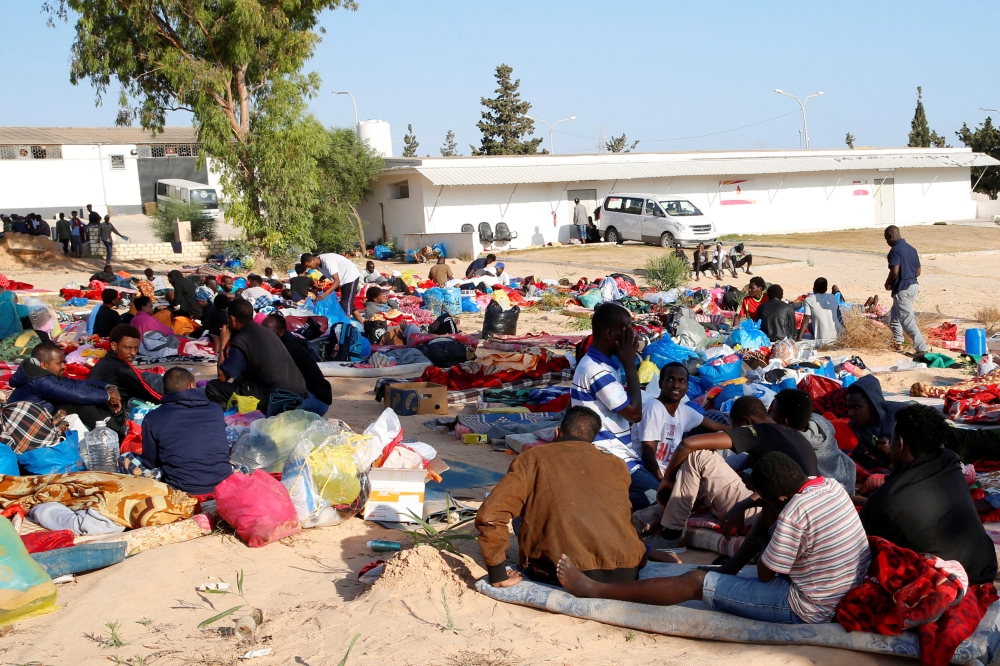 Wounded migrants lie on hospital beds after an airstrike hit a detention center for mainly African migrants in Tajoura, in Tripoli Central Hospital, Libya on Wednesday. — Reuters photos