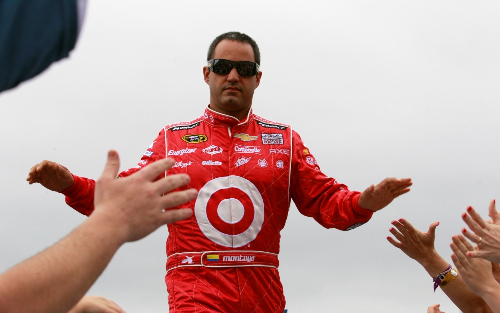 NASCAR driver Juan Pablo Montoya greets fans before the start of the NASCAR Sprint Cup Series Daytona 500 race at the Daytona International Speedway in Daytona Beach, Florida in this file photo of Feb. 24, 2013. — Reuters