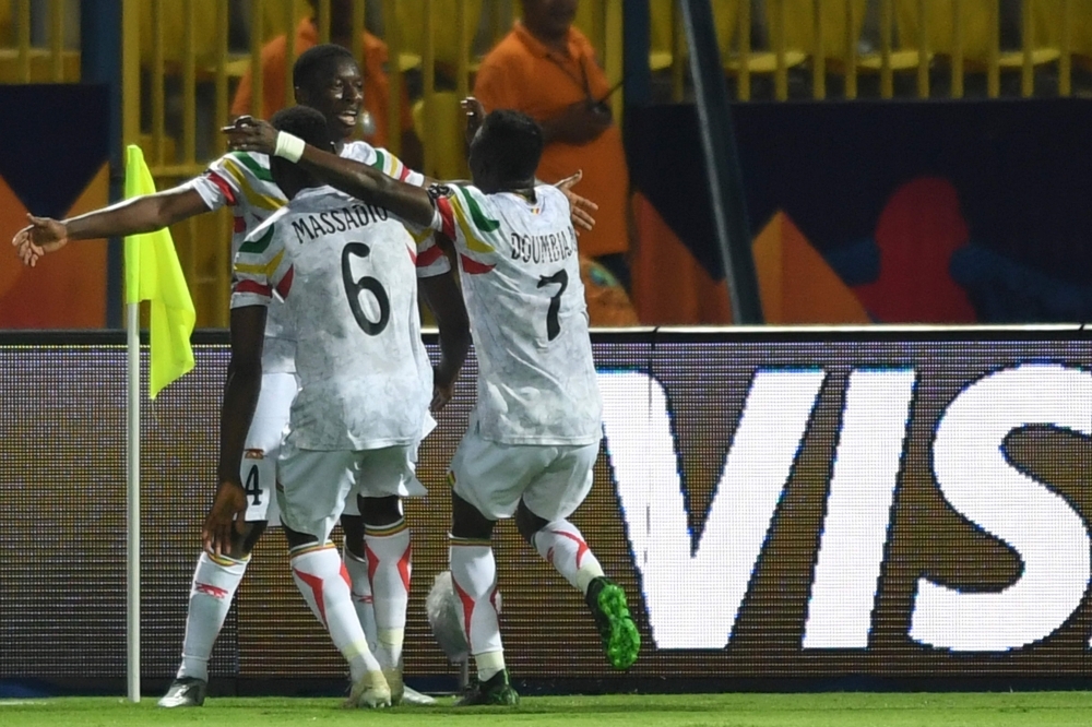 Mali's midfielder Amadou Haidara (L) celebrates his goal with teammates during the 2019 Africa Cup of Nations (CAN) Group E football match against Angola at the Ismailia Stadium in the north-eastern Egyptian city on Tuesday. — AFP