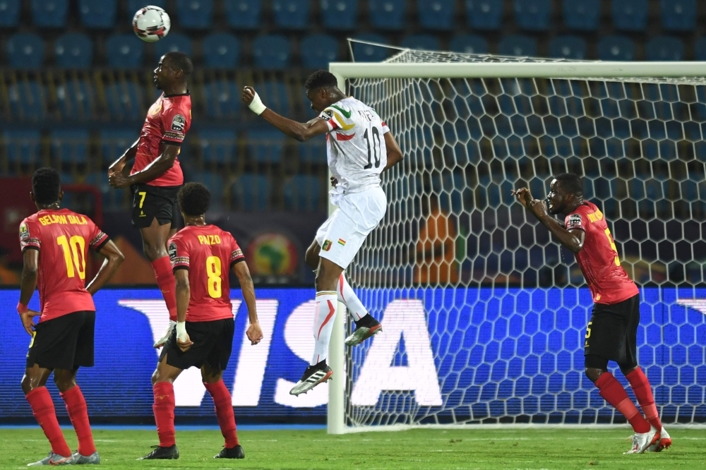 Mali's midfielder Amadou Haidara (L) celebrates his goal with teammates during the 2019 Africa Cup of Nations (CAN) Group E football match against Angola at the Ismailia Stadium in the north-eastern Egyptian city on Tuesday. — AFP