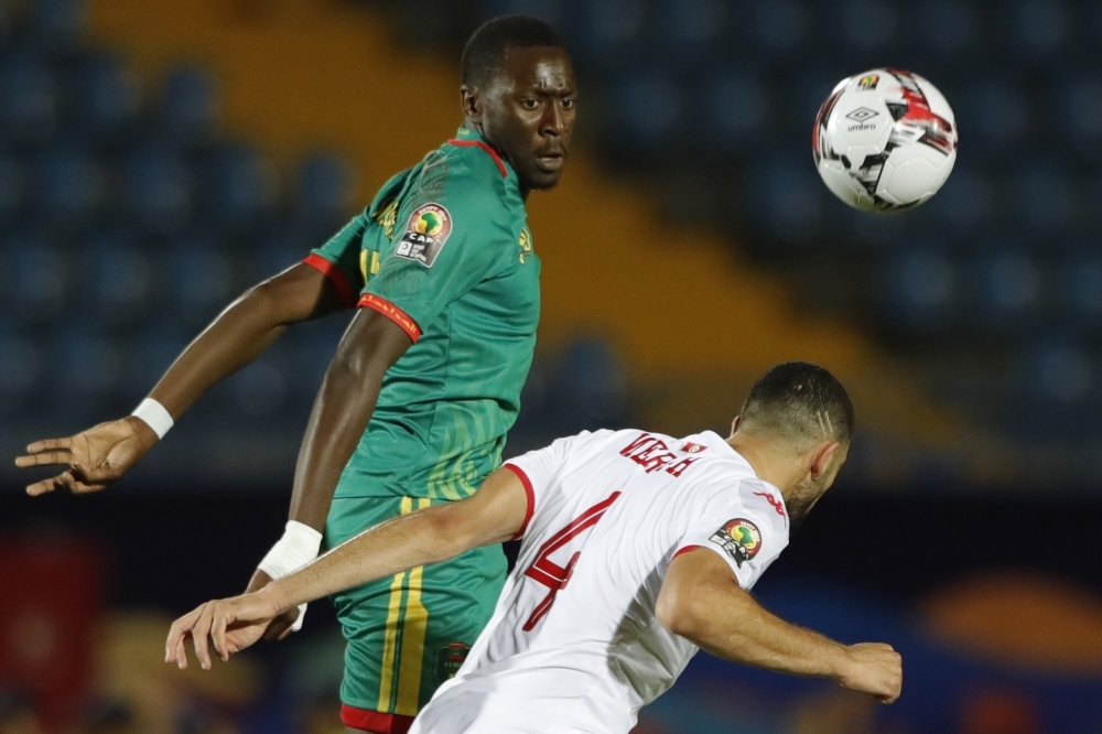 Mauritania's forward Souleymane Anne (L) fights for the ball with Tunisia's defender Yassine Meriah during the 2019 Africa Cup of Nations (CAN) Group E football match at the Suez Stadium in the north-eastern Egyptian city on Tuesday. — AFP