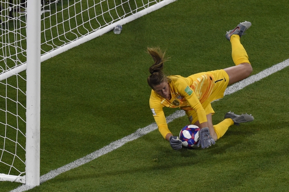 United States' forward Alex Morgan (L) celebrates by sipping a cup of tea after scoring a goal during the France 2019 Women's World Cup semifinal football match against England on Tuesday at the Lyon Satdium in Decines-Charpieu, central-eastern France. — AFP