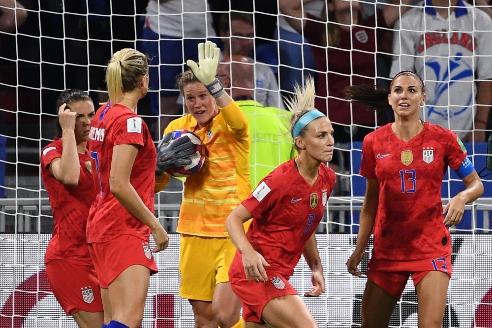 United States' forward Alex Morgan (L) celebrates by sipping a cup of tea after scoring a goal during the France 2019 Women's World Cup semifinal football match against England on Tuesday at the Lyon Satdium in Decines-Charpieu, central-eastern France. — AFP