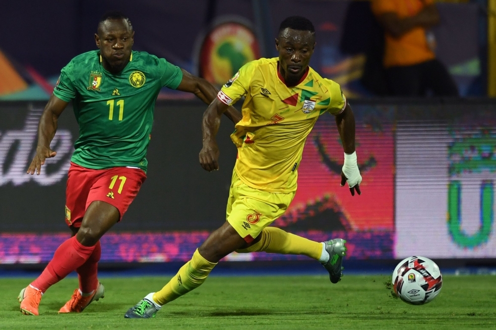 Cameroon's forward Christian Bassogog (L) fights for the ball with Benin's defender Khaled Adenon during the 2019 Africa Cup of Nations (CAN) Group F football match at the Ismailia Stadium in the north-eastern Egyptian city on Tuesday. — AFP