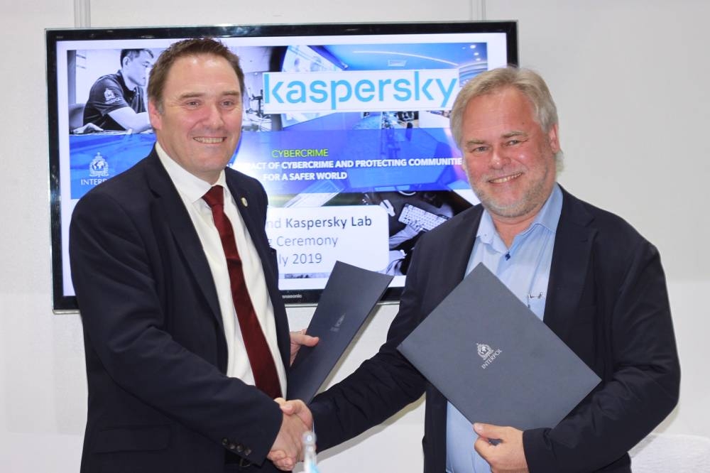 Eugene Kaspersky, CEO of Kaspersky, and Tim Morris, Executive Director of Police Service at Interpol, sign the agreement at Interpol World 2019, which is currently underway in Singapore