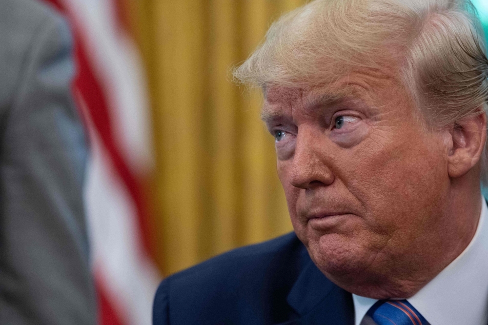 US President Donald Trump speaks to the press after signing a bill for border funding legislation in the Oval Office at the White House in Washington in this July 1, 2019 file photo. — AFP