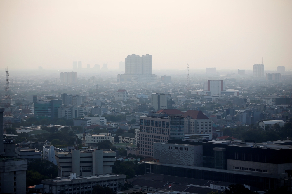 A general view of the capital city as smog covers it in Jakarta, Indonesia, on Thursday. — Reuters