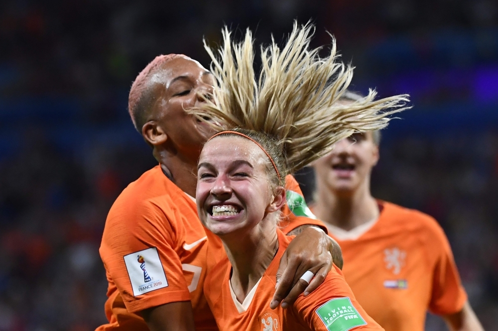 Netherlands' midfielder Jackie Groenen (C) is congratulated by teammates after scoring a goal during the France 2019 Women's World Cup semifinal football match against Sweden at the Lyon Stadium in Decines-Charpieu, central-eastern France, on Wednesday. — AFP 