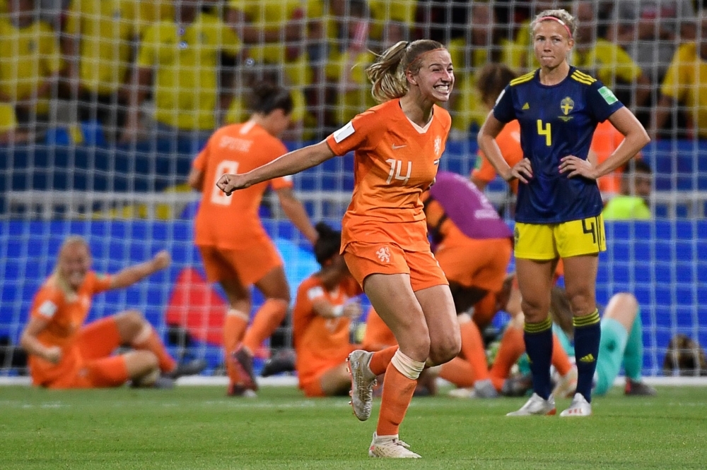 Netherlands' midfielder Jackie Groenen (C) is congratulated by teammates after scoring a goal during the France 2019 Women's World Cup semifinal football match against Sweden at the Lyon Stadium in Decines-Charpieu, central-eastern France, on Wednesday. — AFP 