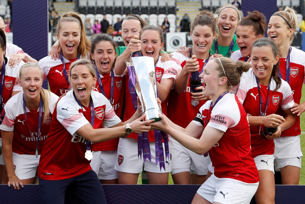 Arsenal celebrates winning the Women's Super League with the trophy  after beating Manchester City at Meadow Park, Borehamwood, Britain in this May 11, 2019, photo. —  Reuters