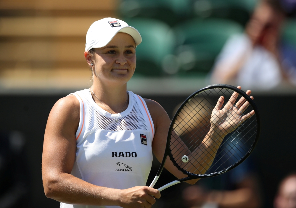 Australia's Ashleigh Barty celebrates after winning her second round match against Belgium's Alison Van Uytvanck at the Wimbledon Championship in London, Britain, on Thursday. — Reuters