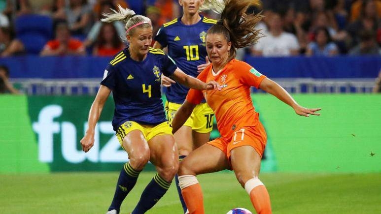 Netherlands' Lieke Martens in action with Sweden's Hanna Glas in the Women's World Cup semifinal at Groupama Stadium, Lyon, France, on Wednesday. — Reuters