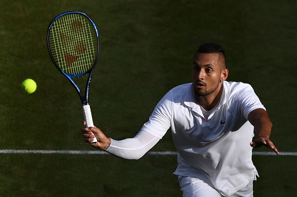 Spain's Rafael Nadal celebrates beating Australia's Nick Kyrgios during their men's singles second round match on the fourth day of the 2019 Wimbledon Championships at The All England Lawn Tennis Club in Wimbledon, southwest London, on Thursday. — AFP