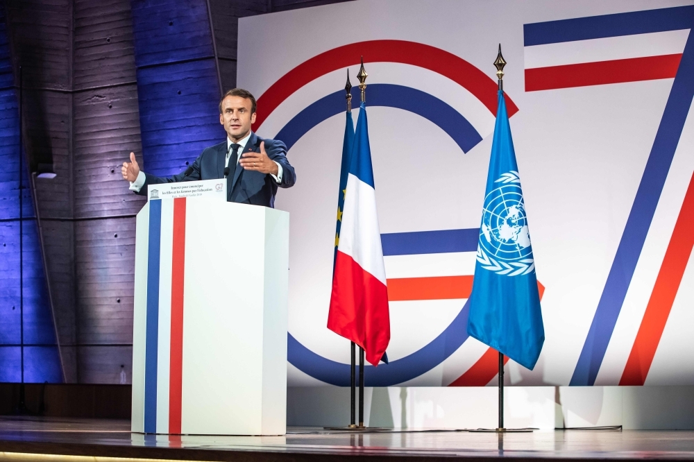 French President Emmanuel Macron delivers a speech at the UNESCO headquarters in Paris on Friday, during the G7 Development and Education Ministers Summit. — AFP