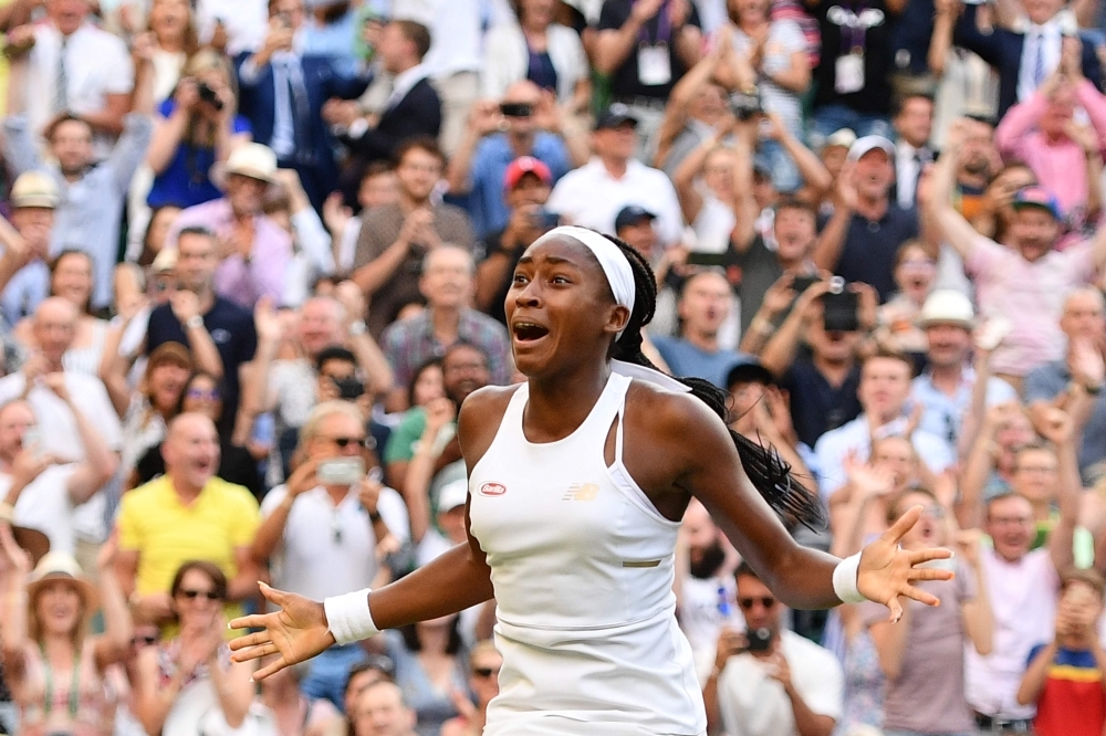 US player Cori Gauff celebrates beating Slovenia's Polona Hercog during their women's singles third round match on the fifth day of the 2019 Wimbledon Championships at The All England Lawn Tennis Club in Wimbledon, southwest London, on Friday. — AFP