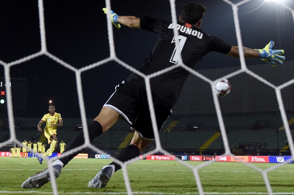 Benin's forward Desire Segbe Azankpo scores during the penalty shootout of the 2019 Africa Cup of Nations (CAN) Round of 16 football match against Morocco at the Al-Salam Stadium in the Egyptian capital Cairo on Friday. — AFP