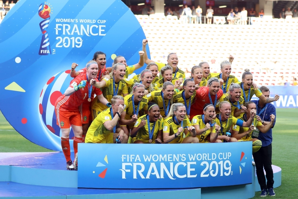 Sweden's players celebrate during the victory ceremony held at the end of the France 2019 Women's World Cup third place final football match between England and Sweden at Nice stadium in Nice south-eastern France, on Saturday. — AFP