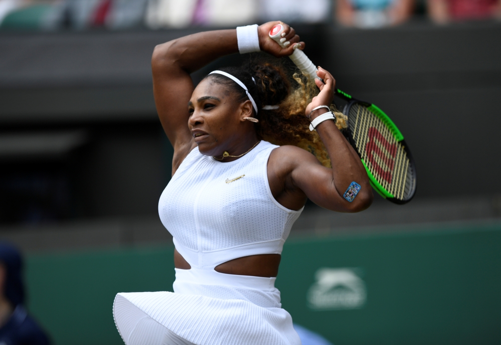 Serena Williams of the US in action during her fourth round Wimbledon match against Spain's Carla Suarez Navarro at All England Lawn Tennis and Croquet Club, London, Britain, on Monday. — Reuters