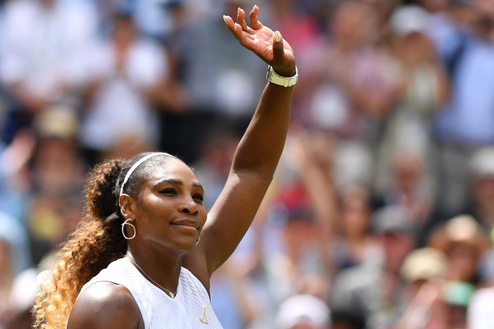 US player Serena Williams celebrates beating Spain's Carla Suarez Navarro during their women's singles fourth round match on the seventh day of the 2019 Wimbledon Championships at The All England Lawn Tennis Club in Wimbledon, southwest London, on Monday. — AFP