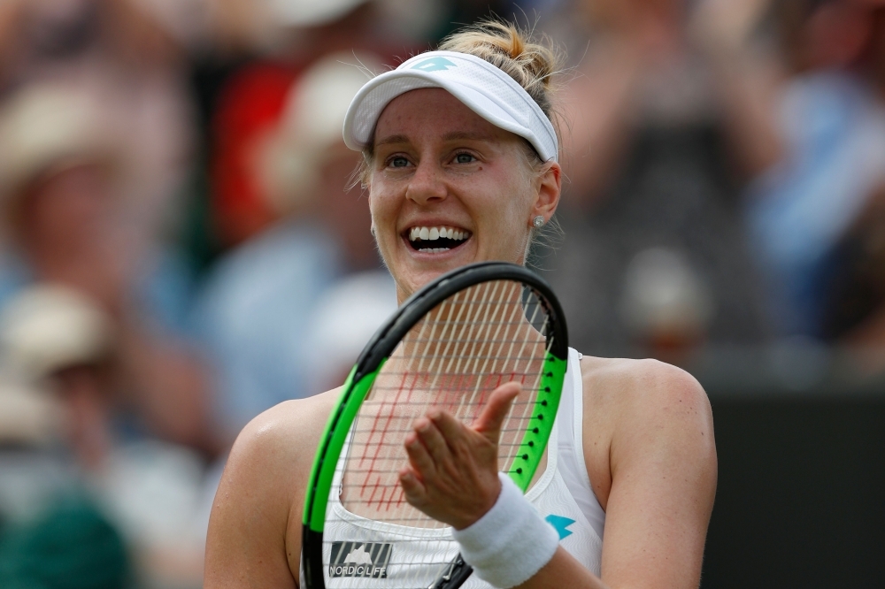US player Alison Riske celebrates beating Australia's Ashleigh Barty during their women's singles fourth round match on the seventh day of the 2019 Wimbledon Championships at The All England Lawn Tennis Club in Wimbledon, southwest London, on Monday. — AFP