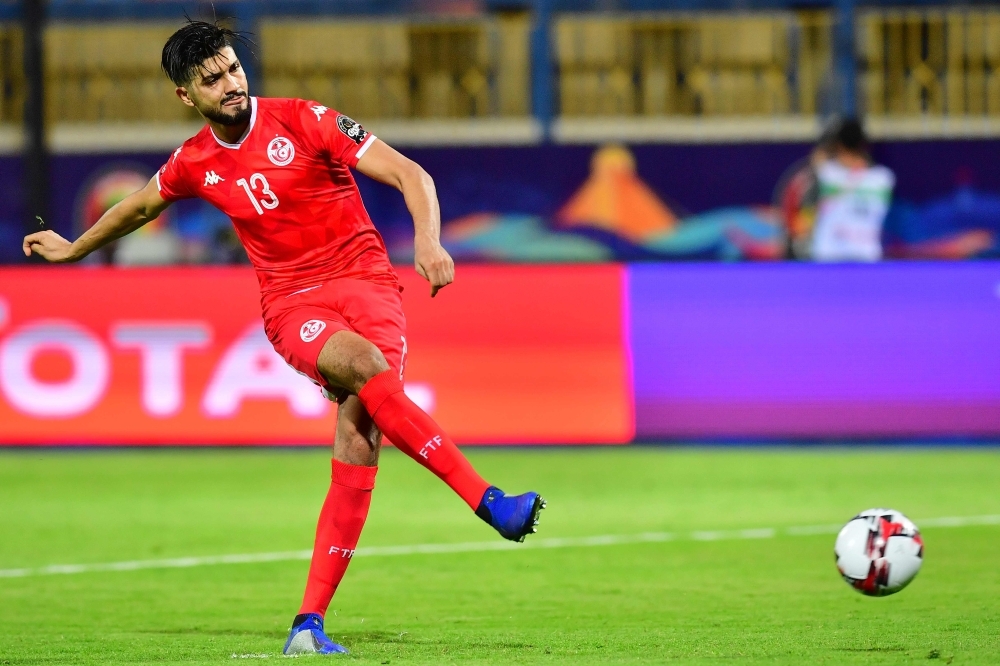 Tunisia's midfielder Ferjani Sassi scores a penalty during the 2019 Africa Cup of Nations (CAN) Round of 16 football match between Ghana and Tunisia at the Ismailia Stadium in the Egyptian city on, Monday. — AFP