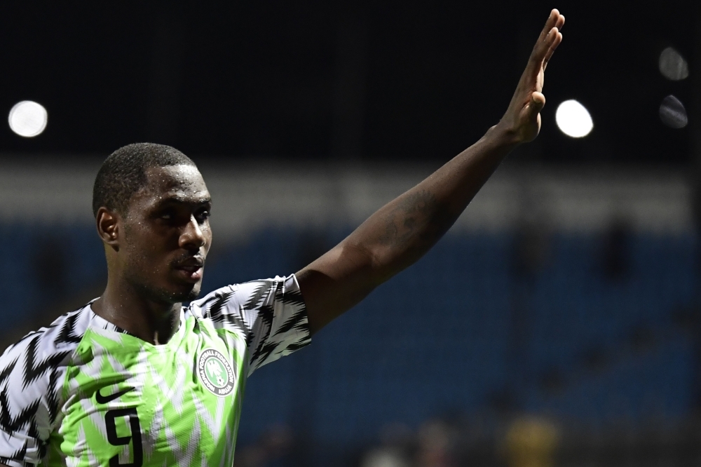 In this file photo taken on July 06, 2019 Nigeria's forward Odion Ighalo greets the fans during the 2019 Africa Cup of Nations (CAN) Round of 16 football match between Nigeria and Cameroon at the Alexandria Stadium in the Egyptian city. Former English Premier League forward Odion Ighalo could be the Nigerian who bursts the South African bubble when the countries clash on July 10 in an Africa Cup of Nations quarterfinal. — AFP