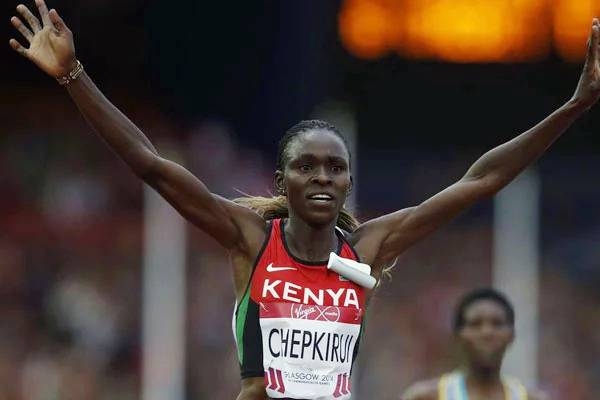 Kenya's Joyce Chepkirui celebrates winning the final of the women's 10,000m athletics event at Hampden Park during the 2014 Commonwealth Games in Glasgow, Scotland on July 29, 2014. — AFP