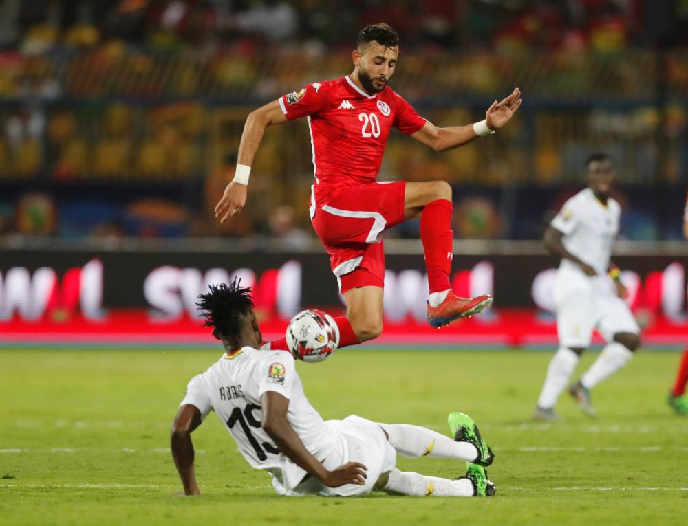 Tunisia's Ghailene Chaalali in action with Ghana's Nuhu Kasim during the Africa Cup of Nations 2019 round of 16 match at the Ismailia Stadium, Ismailia, Egypt, on Monday. — Reuters