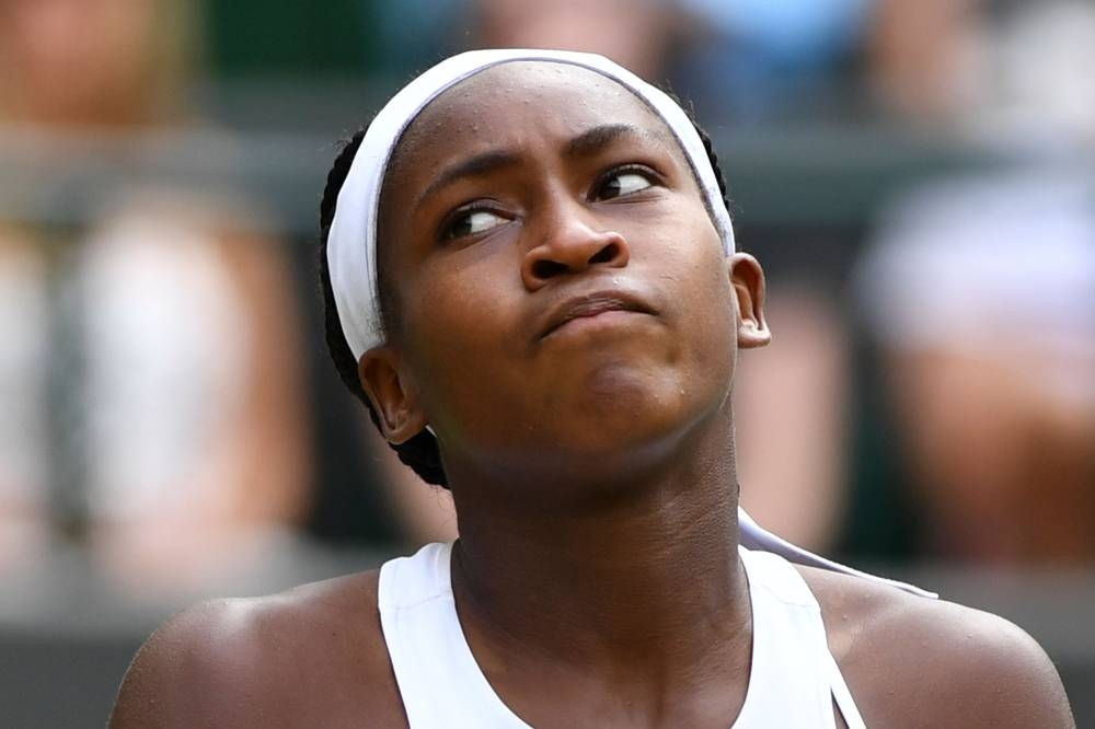 US player Cori Gauff reacts after a point against Romania's Simona Halep during their women's singles fourth round match on the seventh day of the 2019 Wimbledon Championships at The All England Lawn Tennis Club in Wimbledon, southwest London, on Monday. — AFP