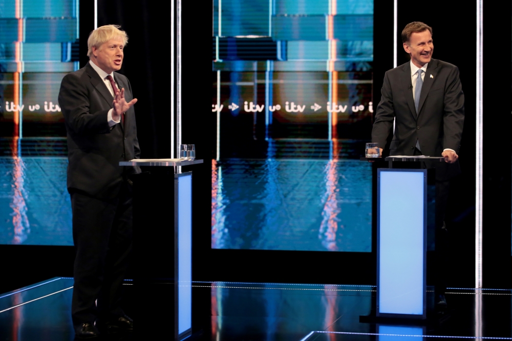 Jeremy Hunt and Boris Johnson, leadership candidates for Britain's Conservative Party, attend Britain’s Next Prime Minister: The ITV Debate at MediaCityUK in Salford, Britain, on Tuesday. — Reuters