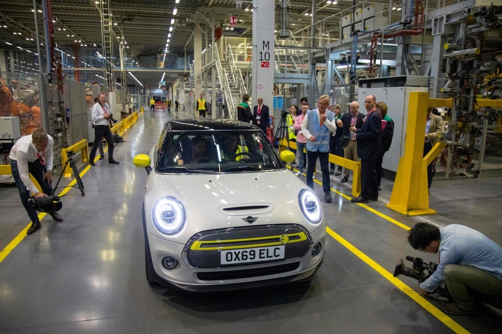 The new MINI electric car is unveiled at the BMW group plant in Cowley, near Oxford, England, on Tuesday. — AFP