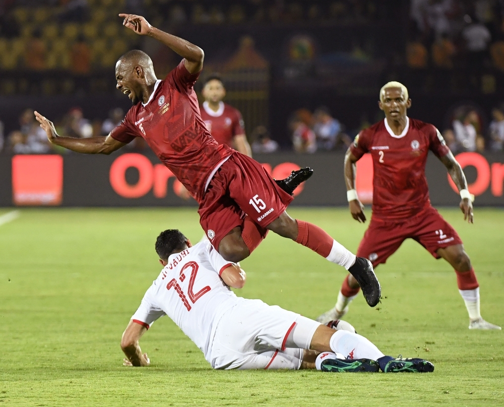 Tunisia's defender Karim Aouadi (L) fights for the ball with Madagascar's midfielder Ibrahim Amada during the 2019 Africa Cup of Nations (CAN) quarterfinal football match at the Al Salam stadium in Cairo on Thursday. — AFP