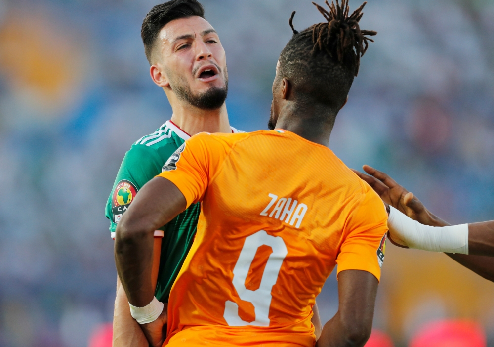 Ivory Coast's Wilfried Zaha clashes with Algeria's Ramy Bensebaini during Africa Cup of Nations 2019 quarterfinal match against Ivory Coast at Suez Stadium, Suez, Egypt, in this July 11, 2019 file photo. — Reuters