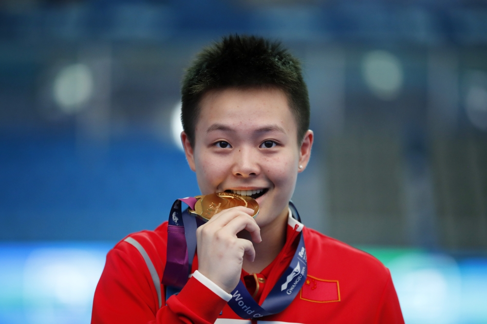 Gold medalist Chen Yiwen of China poses after winning the Women's 1m Springboard in the 8th FINA World Swimming Championships at the Nambu University Municipal Aquatics Center, Gwangju, South Korea, on Saturday. — Reuters