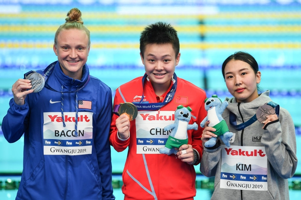 Gold medalist Chen Yiwen of China poses after winning the Women's 1m Springboard in the 8th FINA World Swimming Championships at the Nambu University Municipal Aquatics Center, Gwangju, South Korea, on Saturday. — Reuters